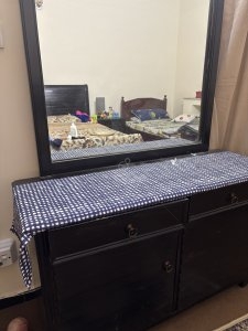 Polished double bed with side tables and dressing table